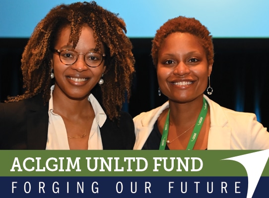 Photo of two SGIM meeting attendees posing for a photo with the caption 'ACLGIM UNLTD FUND: Forging Our Future,' accompanied by a white arrow in the style of the SGIM logo.