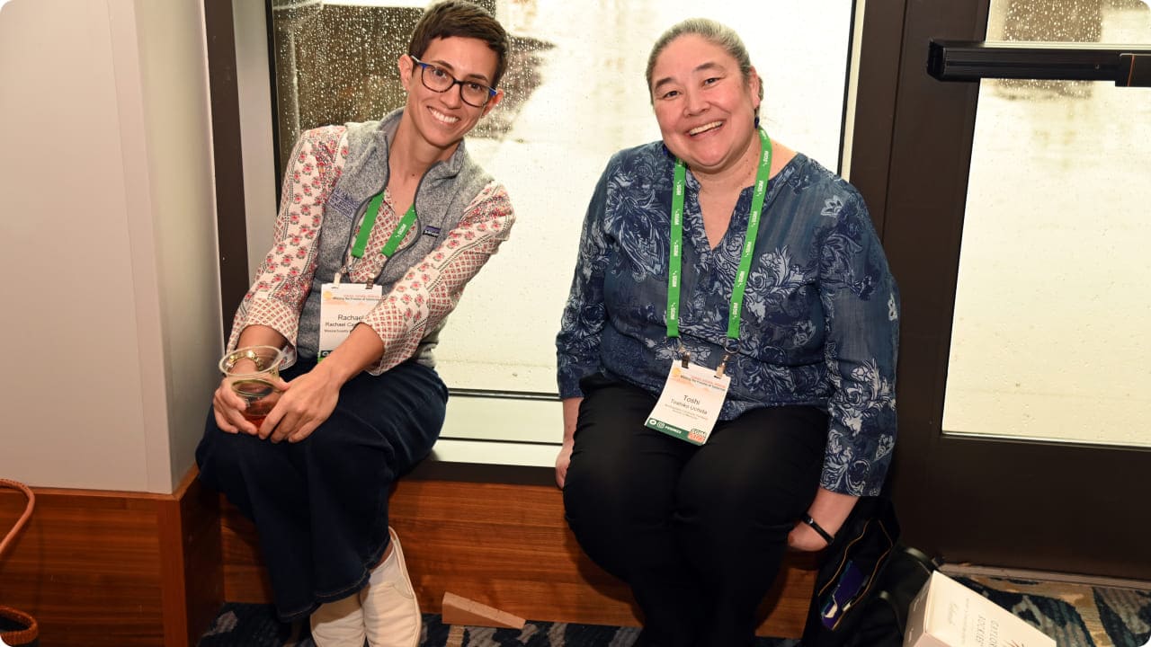 Two SGIM meeting attendees posing together for a photo during a break.