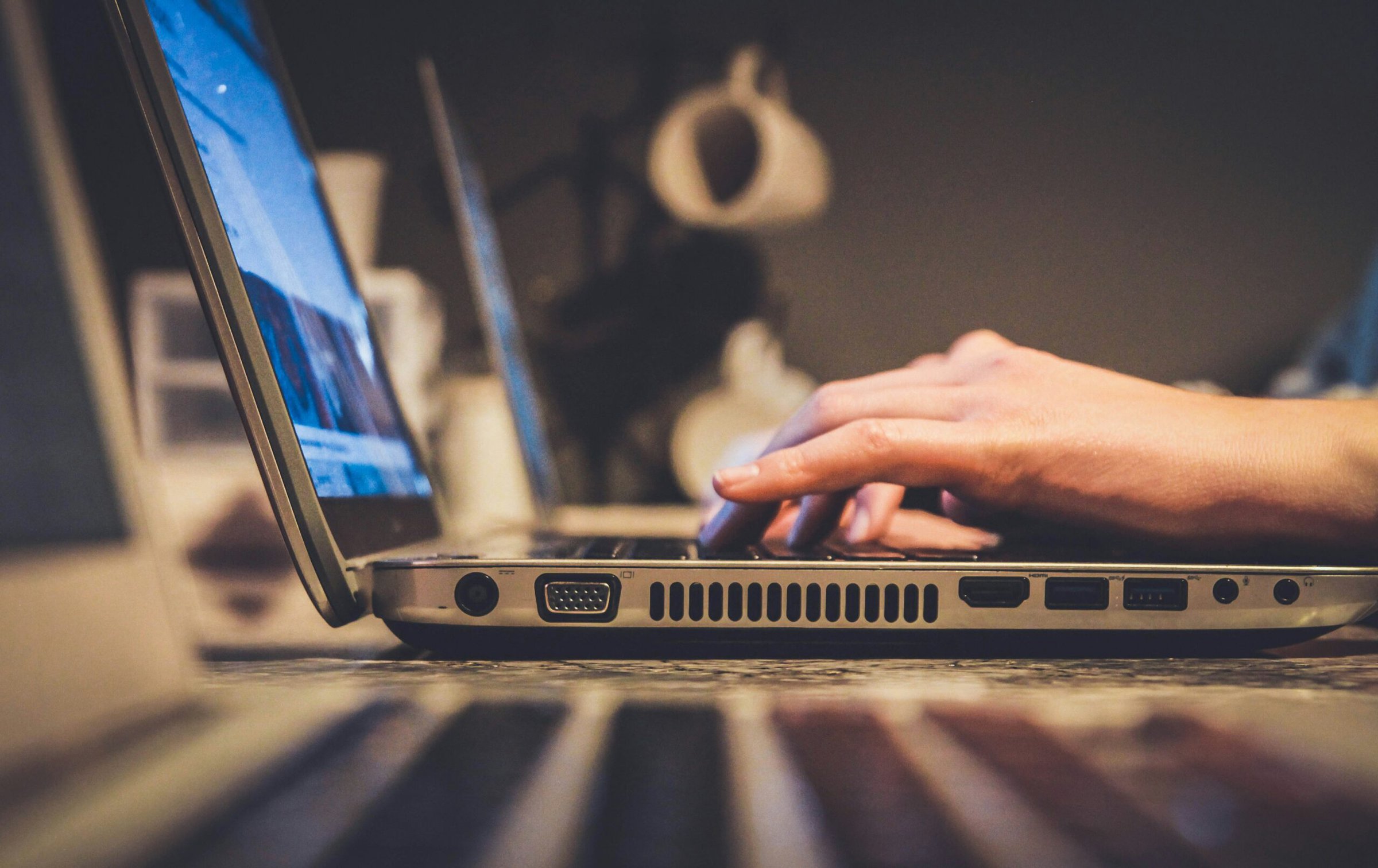 Asychronous-course An image of hands typing on a laptop