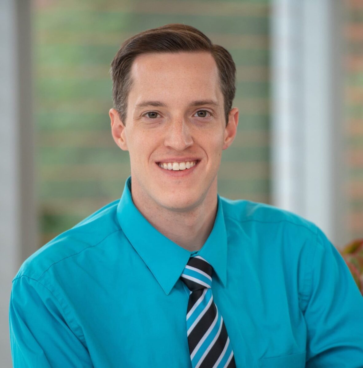 Headshot photo of Patrick Sayre