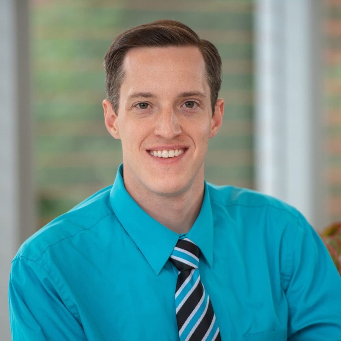 Headshot photo of Patrick Sayre