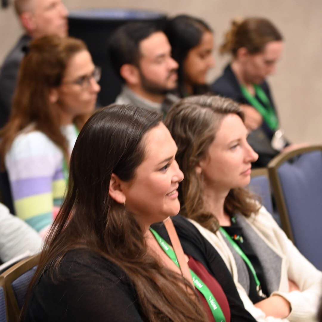 Photo of audience members watching a presentation at the SGIM 2023 Annual Meeting