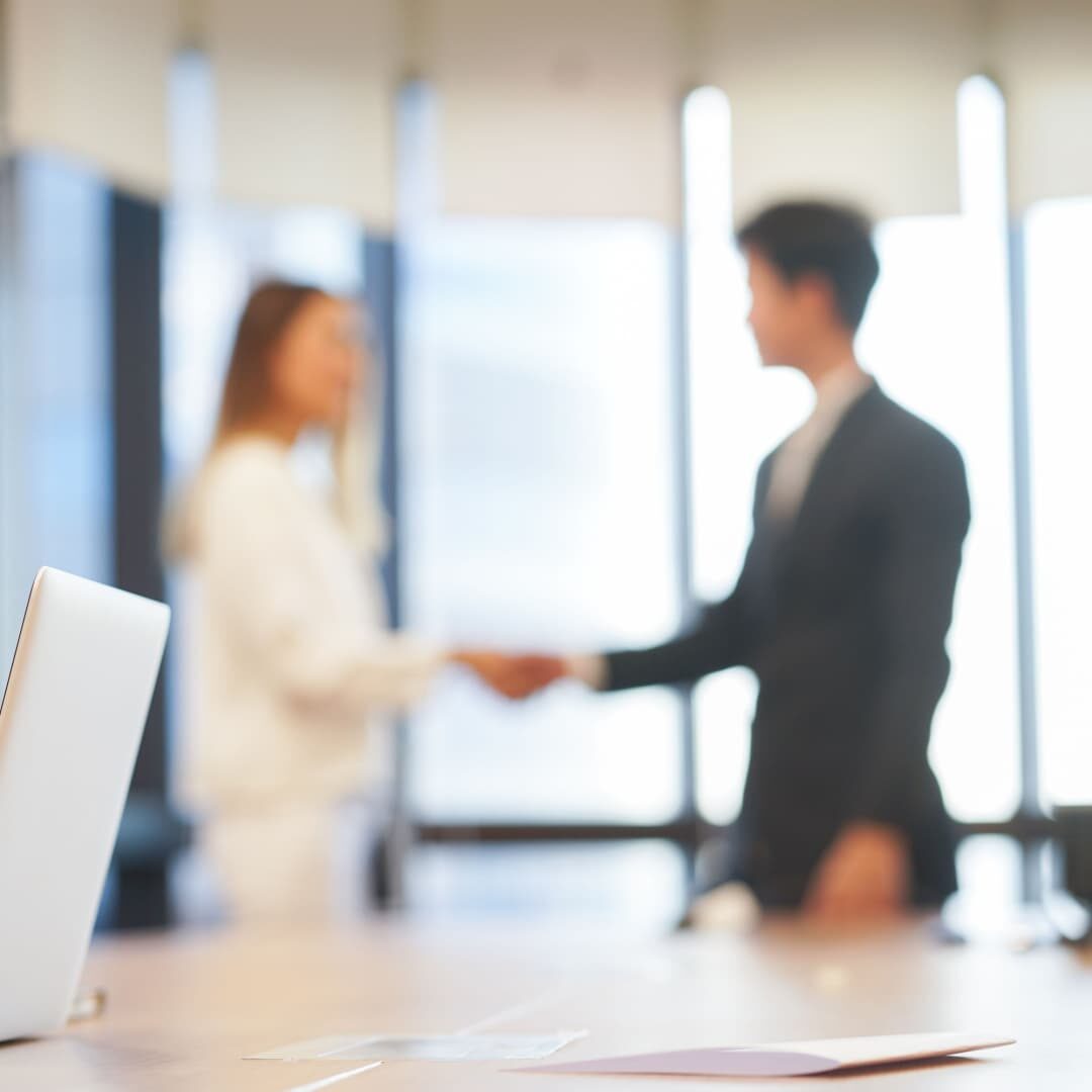 Business people shaking hands.