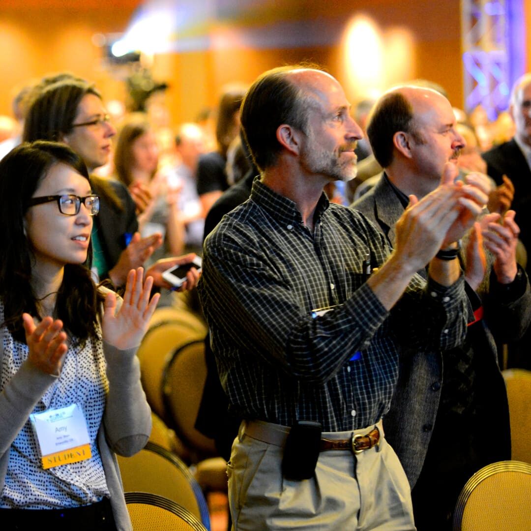 Event attendees clapping in appreciation